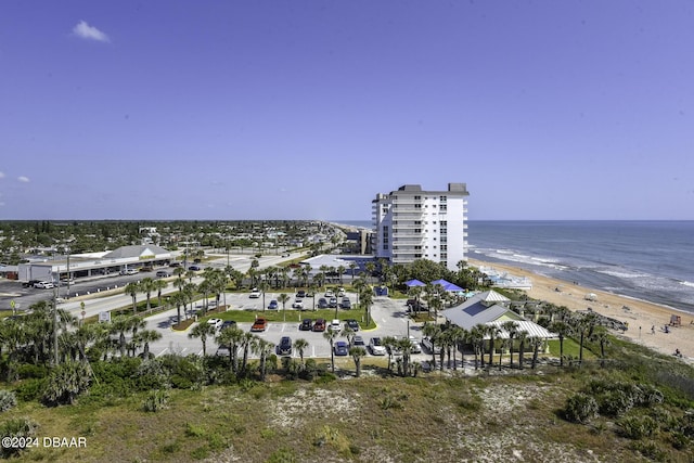 aerial view featuring a view of the beach and a water view