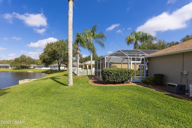 view of yard featuring a water view and a lanai