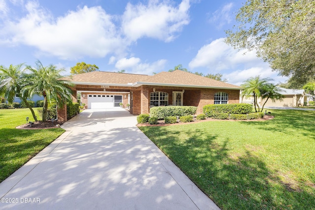 view of front of house featuring a garage and a front yard