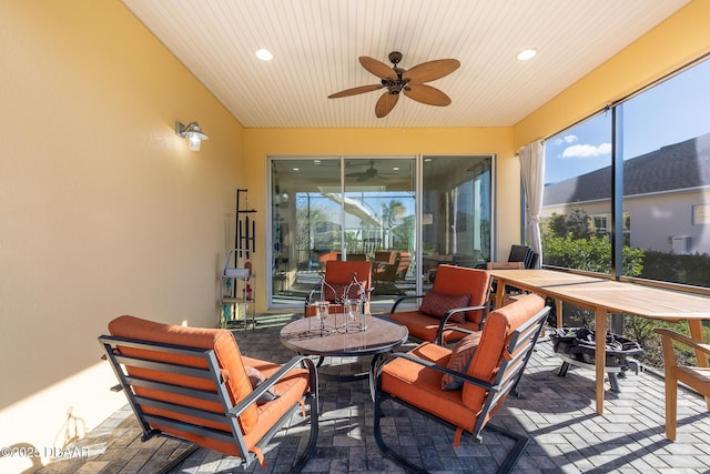 sunroom / solarium with ceiling fan