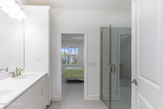 bathroom with tile patterned floors, vanity, and walk in shower