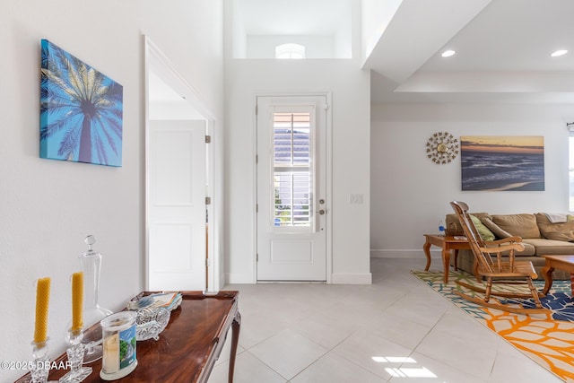 foyer entrance featuring light tile patterned floors