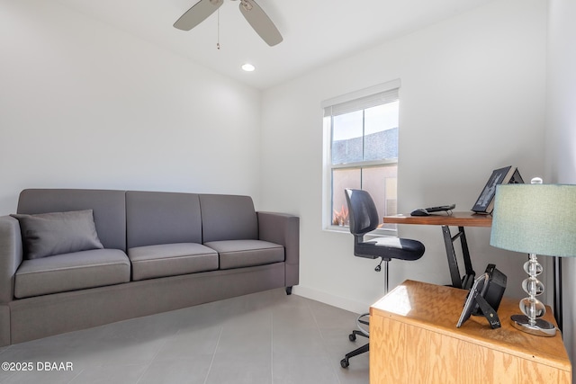 tiled home office featuring ceiling fan