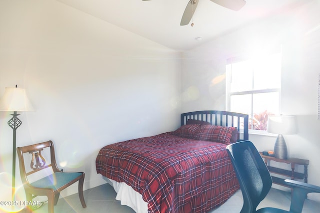 bedroom with ceiling fan and light tile patterned floors