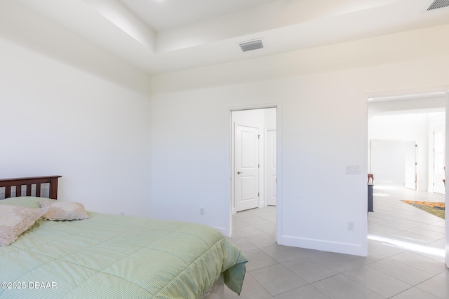 bedroom featuring light tile patterned floors