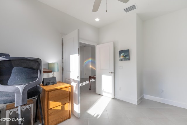 home office with ceiling fan and light tile patterned flooring