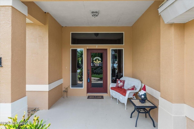 entrance to property featuring a patio area