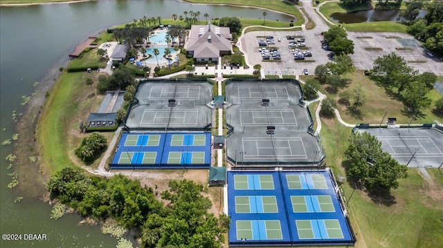 birds eye view of property with a water view