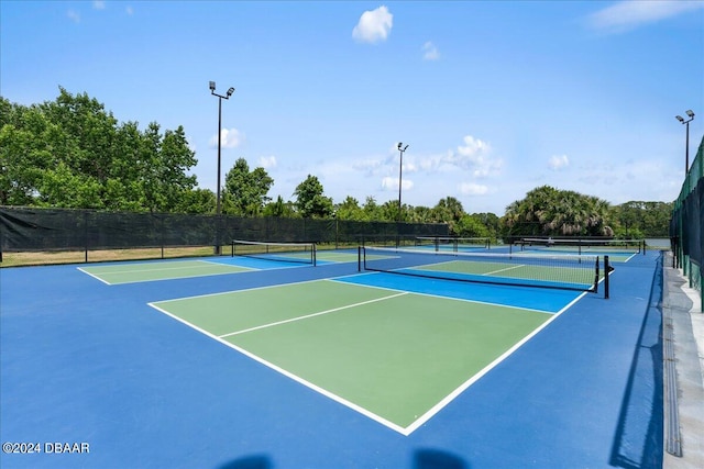 view of sport court featuring basketball hoop