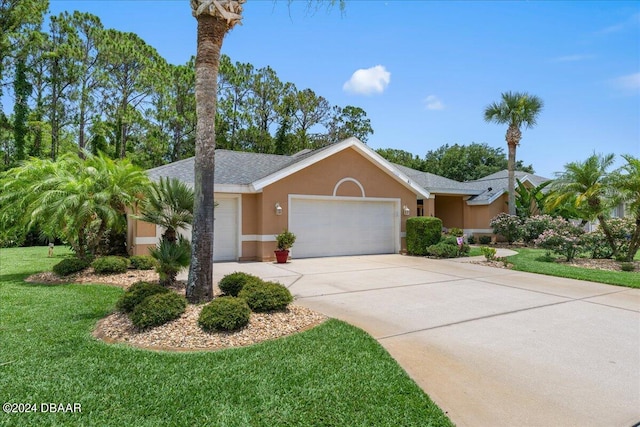 ranch-style house featuring a garage and a front yard