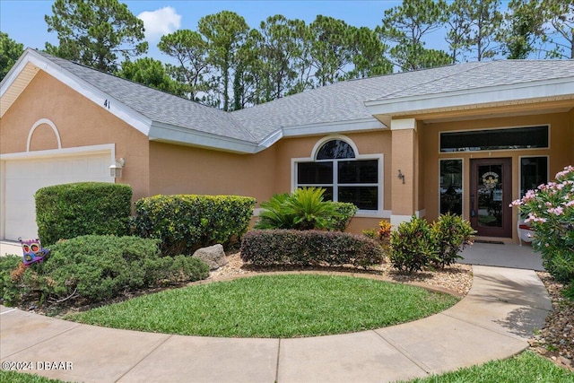 view of front of home with a garage