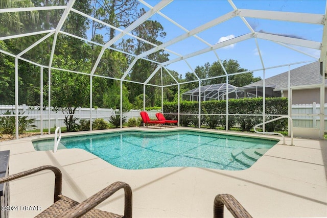 view of pool featuring a lanai and a patio area