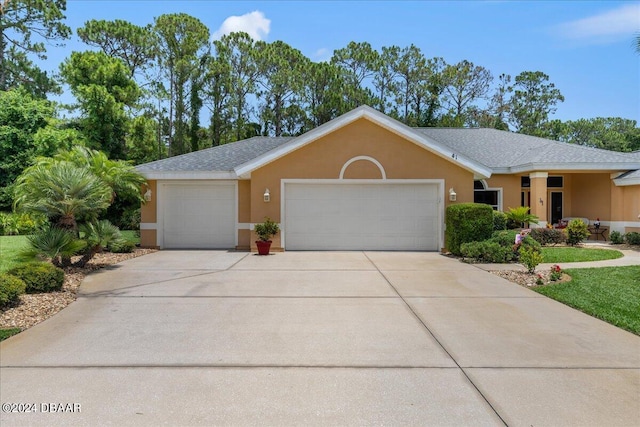 ranch-style home with a garage