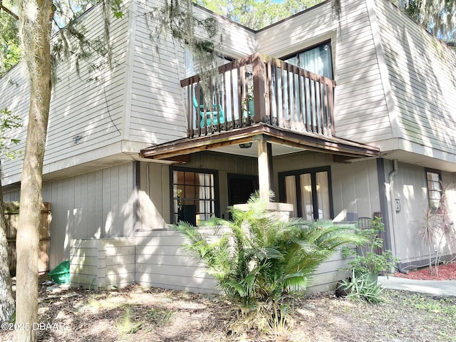 view of property exterior featuring a balcony