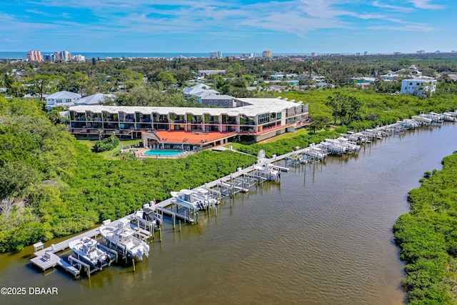 birds eye view of property with a water view