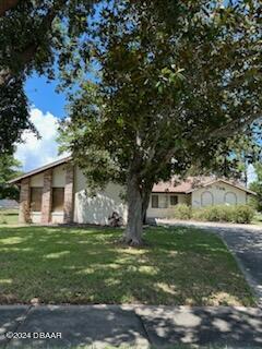 5808 Westport Dr, Port Orange, FL 32127 - view of front of property featuring a front lawn
