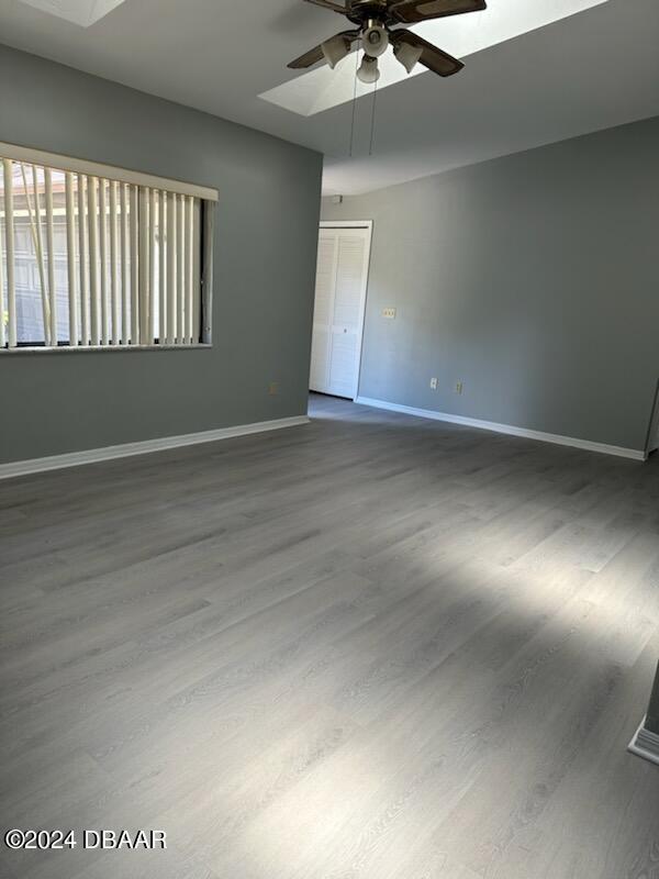 5808 Westport Dr, Port Orange, FL 32127 - unfurnished room with a ceiling fan, baseboards, and wood finished floors