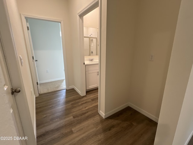 hall with dark hardwood / wood-style flooring