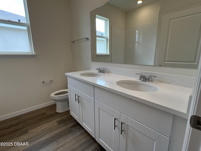 bathroom featuring vanity, toilet, and wood-type flooring