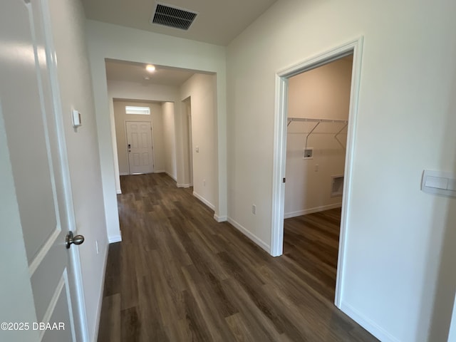 corridor featuring dark wood-type flooring