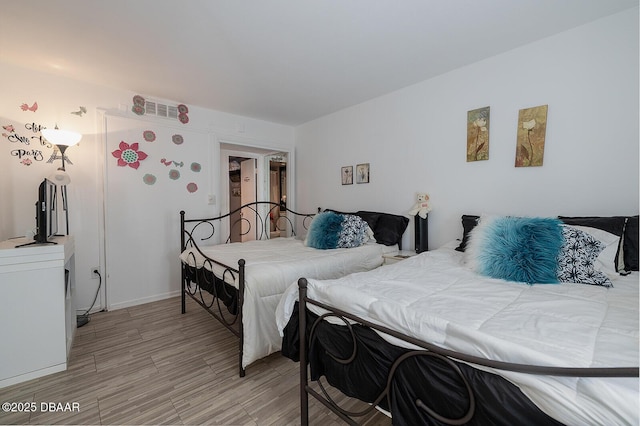2800 N Atlantic Ave Unit 1105, Daytona Beach, FL 32118 - bedroom with light wood finished floors