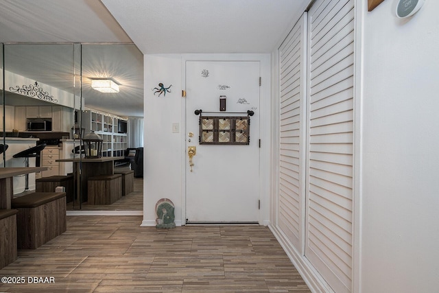 2800 N Atlantic Ave Unit 1105, Daytona Beach, FL 32118 - foyer featuring wood finished floors