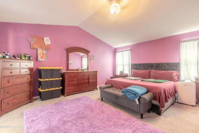 carpeted bedroom featuring ceiling fan and lofted ceiling