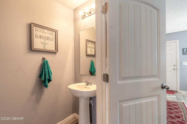 bathroom featuring hardwood / wood-style floors and sink