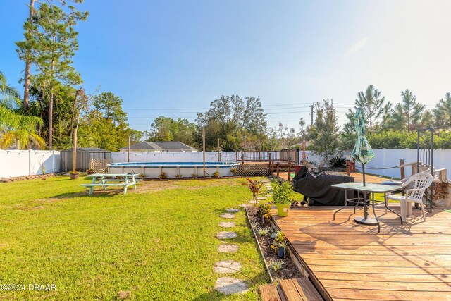 view of yard featuring a pool side deck