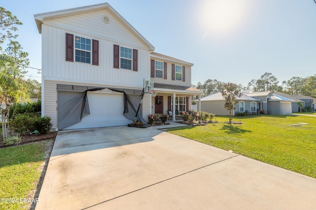 view of front of property with a garage and a front yard