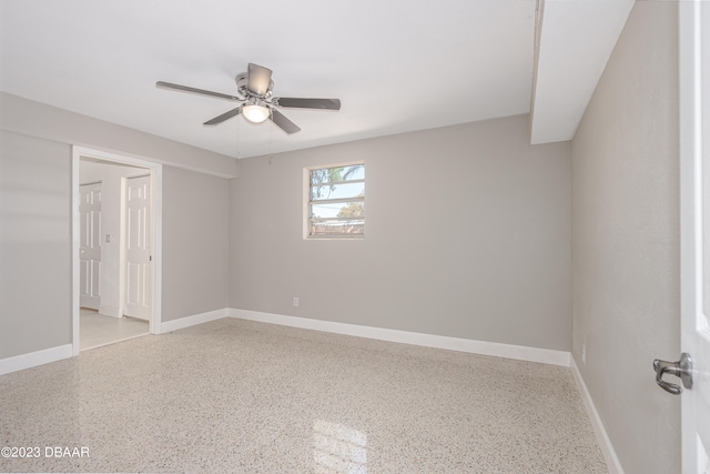 unfurnished room with ceiling fan