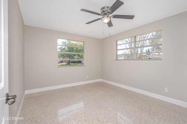 spare room with ceiling fan