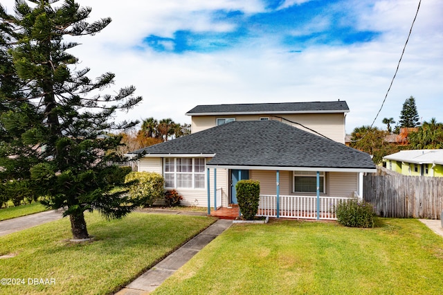 view of front facade with a porch and a front lawn