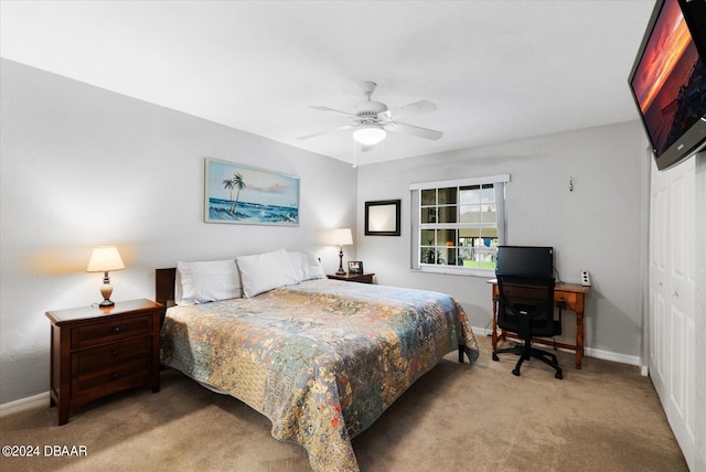 carpeted bedroom with a closet and ceiling fan