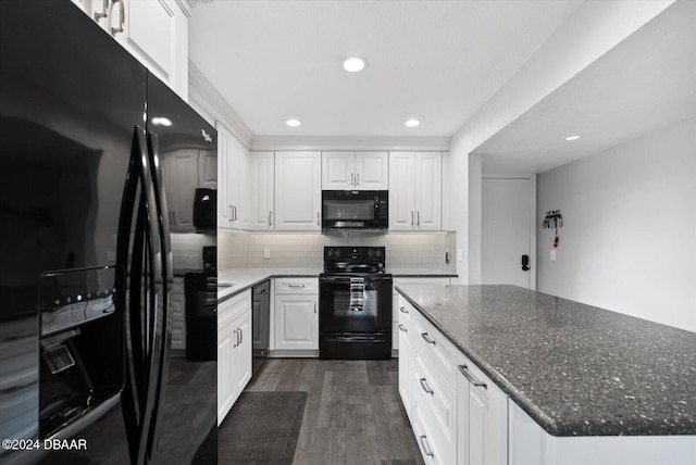 kitchen featuring backsplash, dark stone counters, black appliances, dark hardwood / wood-style floors, and white cabinetry