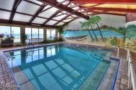 view of pool featuring a water view