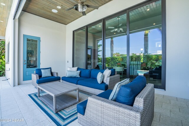 view of patio with ceiling fan and an outdoor living space