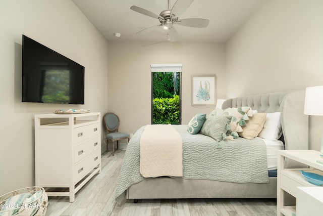 bedroom with ceiling fan and light wood-type flooring