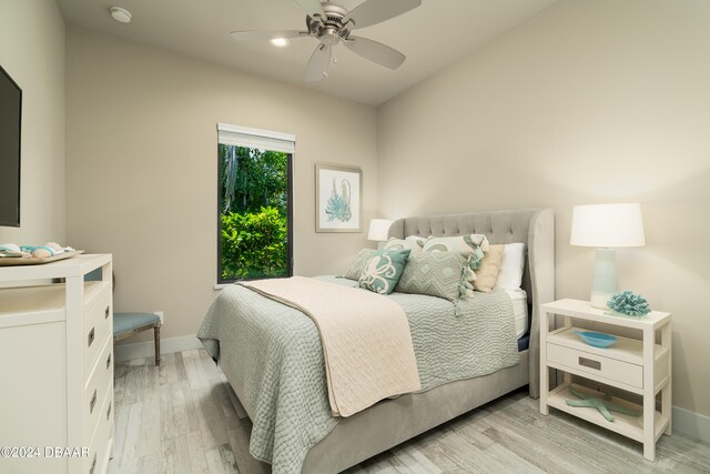 bedroom featuring light hardwood / wood-style floors and ceiling fan