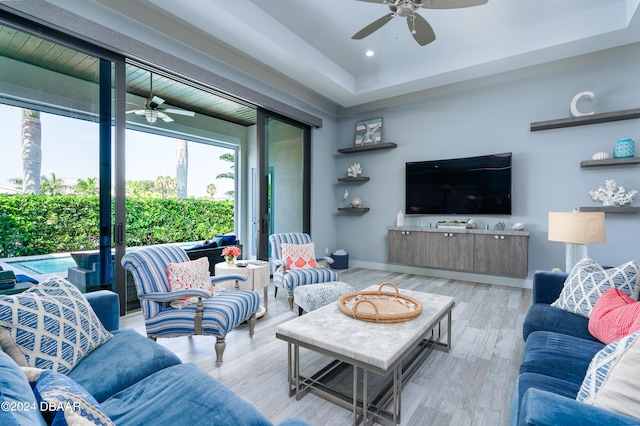 living room featuring ceiling fan and light wood-type flooring