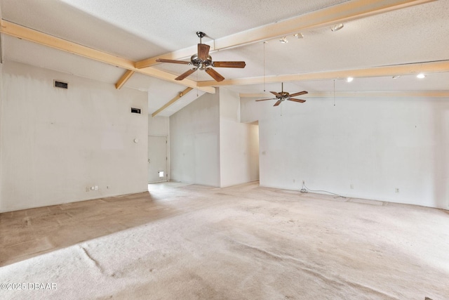 spare room featuring a textured ceiling, high vaulted ceiling, visible vents, beam ceiling, and carpet