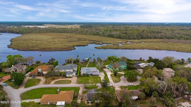 bird's eye view featuring a water view, a residential view, and a view of trees