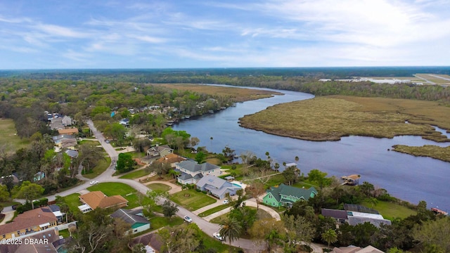 birds eye view of property with a water view, a forest view, and a residential view