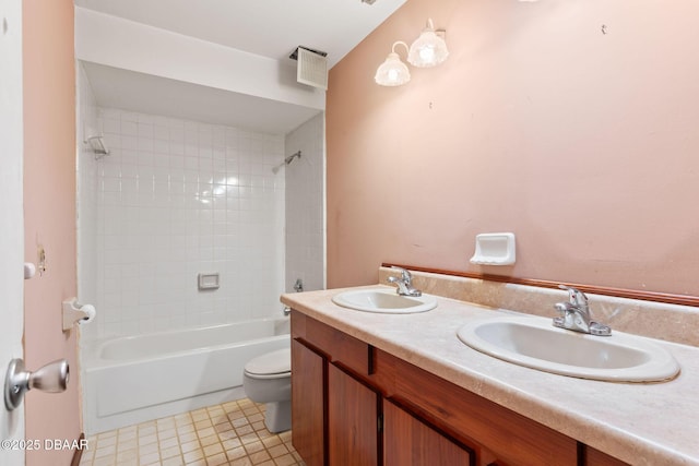 full bath with toilet, bathtub / shower combination, visible vents, and a sink