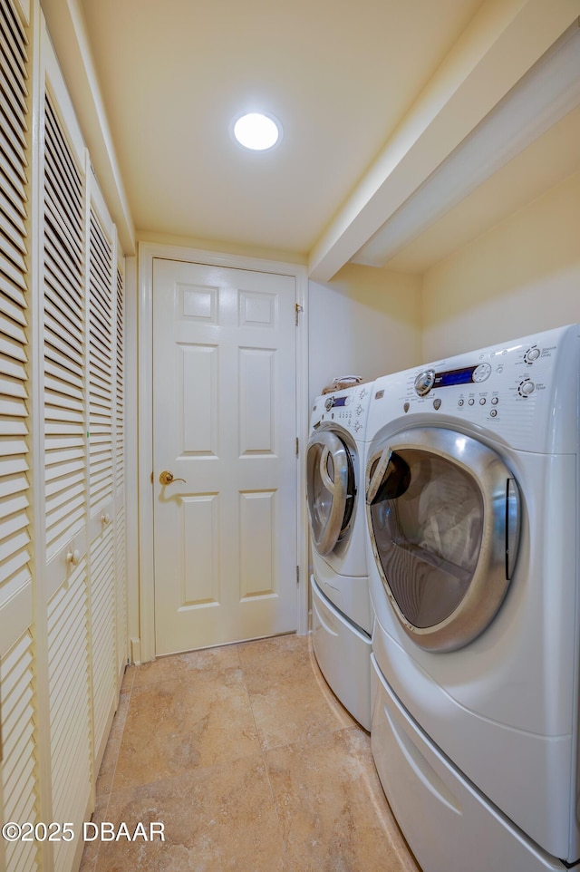 laundry room with separate washer and dryer