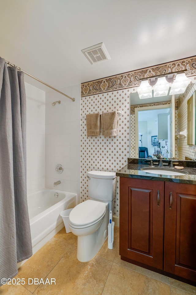 full bathroom featuring shower / bathtub combination with curtain, vanity, tile patterned flooring, and toilet