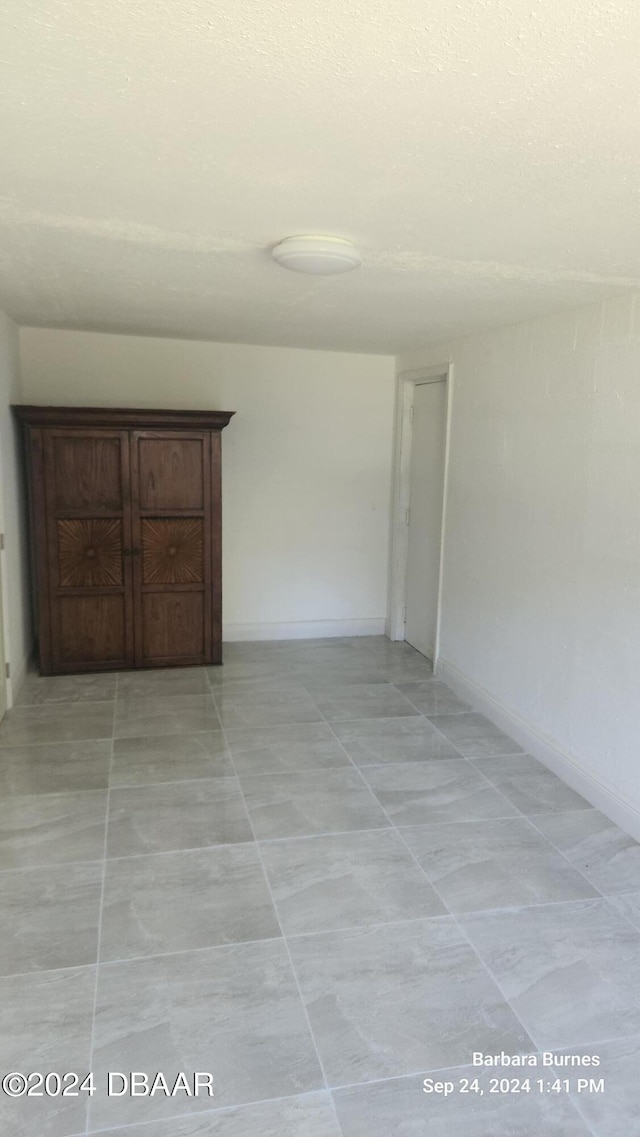 view of tiled spare room