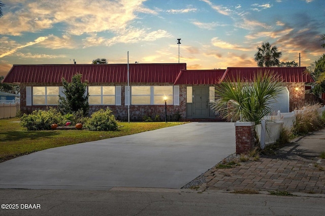 view of front facade featuring fence