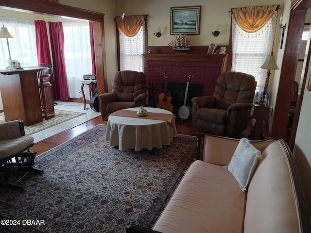 living room featuring a fireplace and hardwood / wood-style flooring