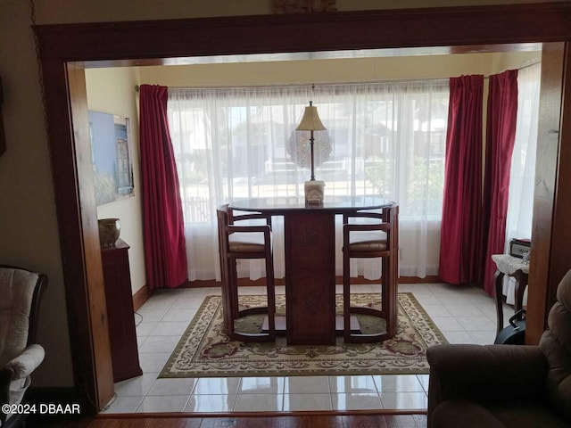 dining area with light tile patterned floors